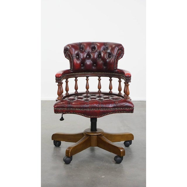 We are offering this red classic swivel cowhide Chesterfield office chair on casters with a timeless look. Can you already...