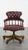 We are offering this red classic swivel cowhide Chesterfield office chair on casters with a timeless look. Can you already...
