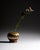 A compact studio ceramic vase with softly rounded proportions and layered beige-brown glaze transitions. The flowing...