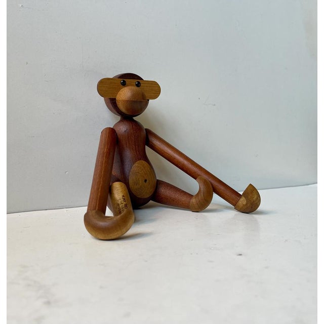Wooden monkey designed by Kay Bojesen in 1951. Its made from solid teak and limba wood. It features articulated limbs,...