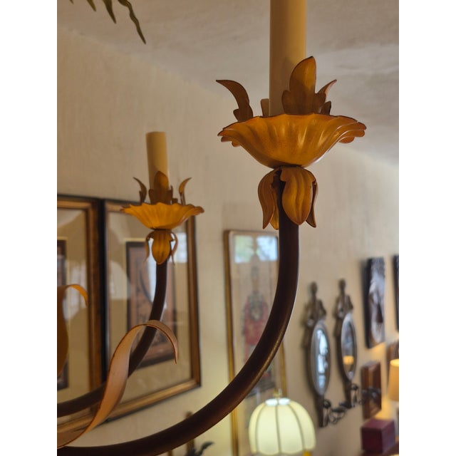 Boho chic whimsical vintage tole palm tree light fixture having palm fronds over six elegant arms with leaves.