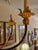 Boho chic whimsical vintage tole palm tree light fixture having palm fronds over six elegant arms with leaves.