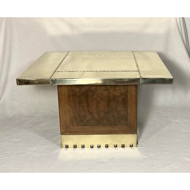 1970s square polished brass coffee table with a riveted design and a burlwood brass square base. Quite heavy, 42 pounds.