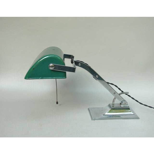 An exceptional banker's lamp from the Art Deco period, crafted in the characteristically austere style of the era. The...