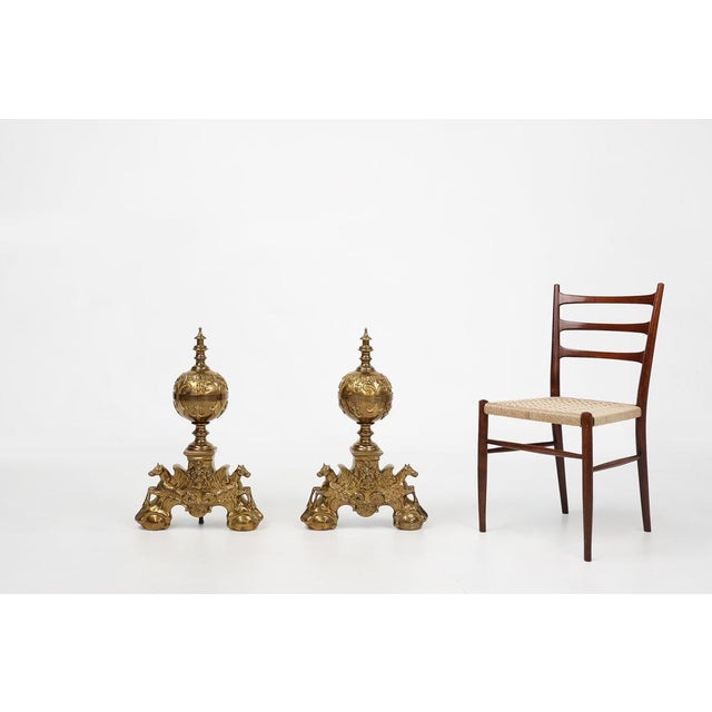 A highly decorative pair of French firebucks crafted in the 20th century in Neo-classic style. These exceptional set was...