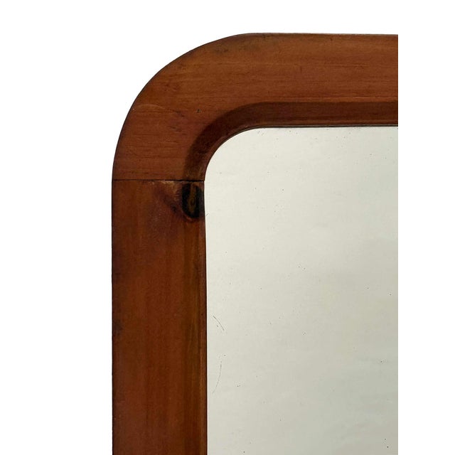 Early 20th century, antique rounded pine mirror. Wired, ready to hang. Mirror glass has some areas/marks on back of glass...