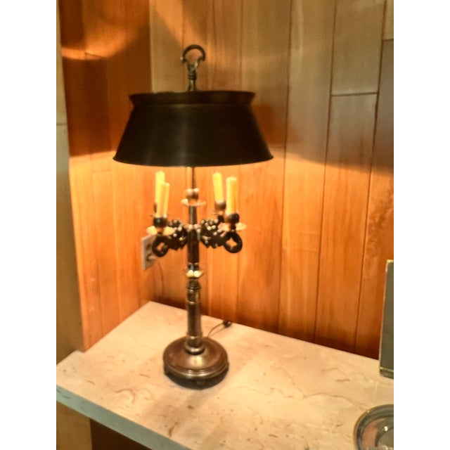 A striking pair of Frederick Cooper bouillotte table lamps, crafted in the mid-20th century. These lamps embody timeless...