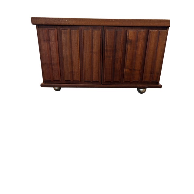 A Quiet Masterwork of Form and Function This square mid-century modern coffee table is a study in restraint, rhythm, and...