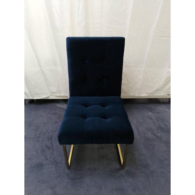 Description Minimalist Comfort. Pared down geometry in polished brass meets swanky Rialto Navy velvet. The perfectly...