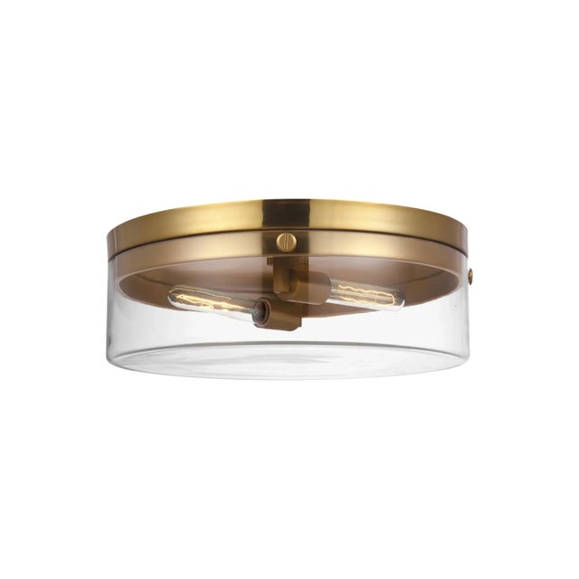 Garrett from Chapman & Myers for Generation Lighting features cylindrical Clear Extruded Glass shades paired with...