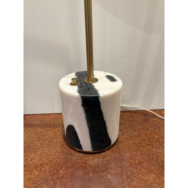 Stylish Revelation Pivot Floor Lamp. Panda marble base, brass frame, white drum shade. Original Retail $1005. Showroom...