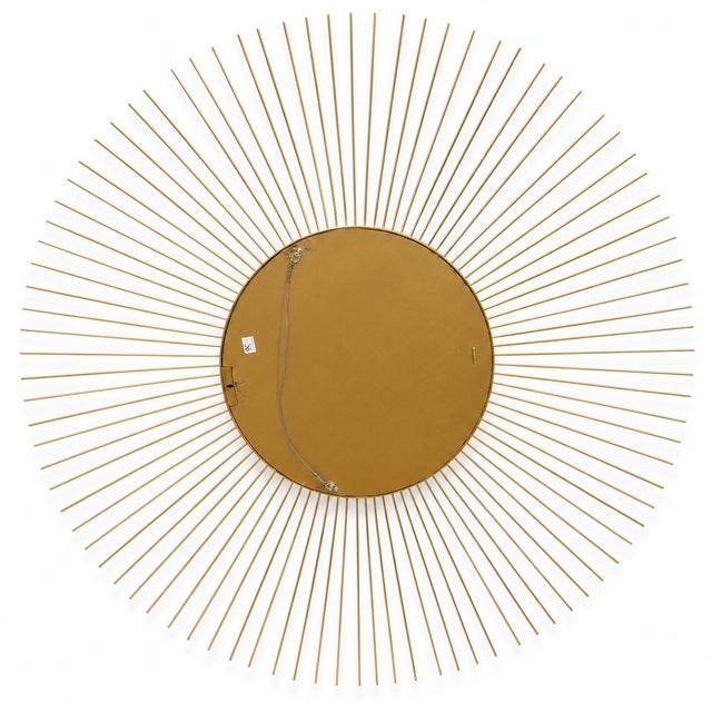 Bring dramatic architectural style to any space with this authentic Oly Studio oversized sunburst wall mirror. Crafted...