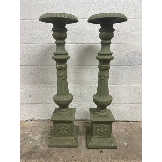A truly monumental pair of cast iron floor candlesticks from the Asheville Estate Collection, standing at an impressive 41...
