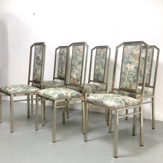Elegant high back chromed steel dining chairs. Upholstered in muted pastel pattern of clouds. Originally part of dining...
