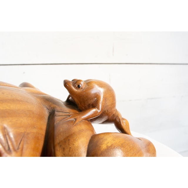 This large statue made from a single piece of national walnut wood represents a naturalistic symbol widely used in art...