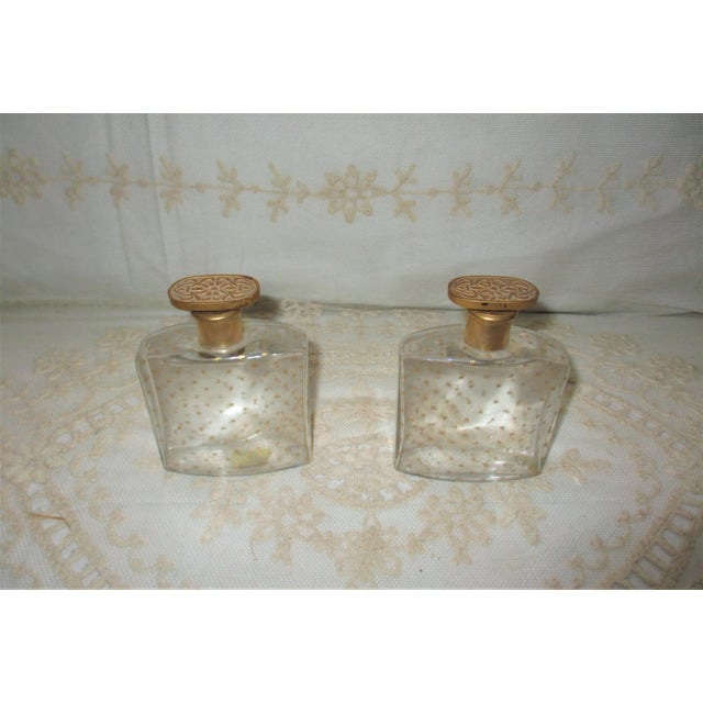 This is a Pair of 1800's French Glass Perfume Bottles with a Gorgeous overall Star Design with an Elaborate Stoppers with...