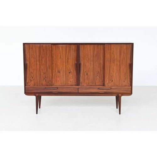 Beautiful highboard model 13 designed by Gunni Omann and manufactured by Omann Jun, Denmark 1960. Superb example of Danish...