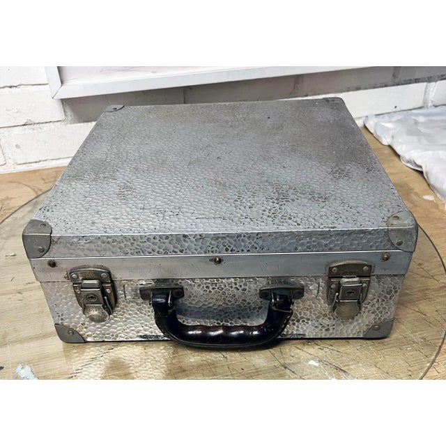 High quality example of mid century camera suitcase. Measures 14 x 14 x 5.5”. Lined in deep red velvet.There aere issues...