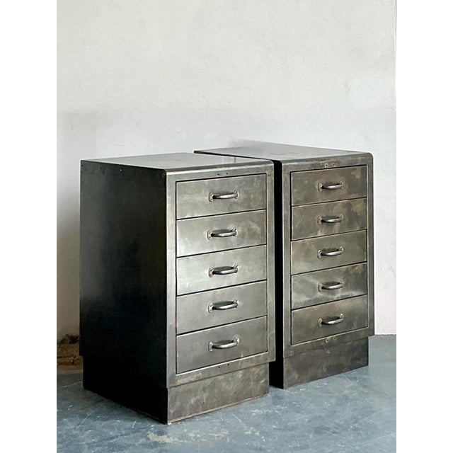 Inject raw character and functional design into your space with this impressive pair of vintage industrial metal filing...