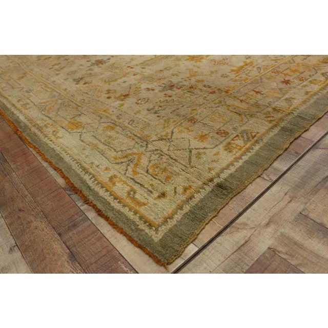 73716 Late 19th Century Antique Turkish Oushak Angora Wool Rug with Georgian Chippendale Style 07'04 x 09'00. This hand-...