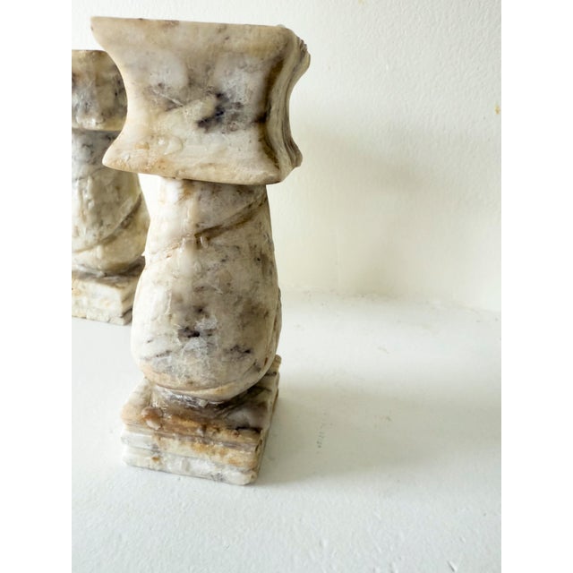 This pair of vintage 1950s stone candle holders is made from natural marble or onyx, each displaying unique veining in...
