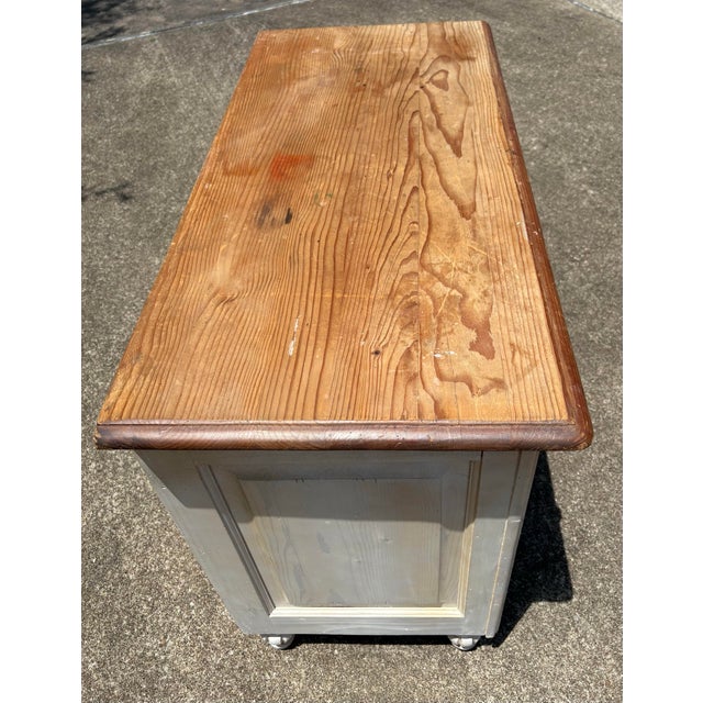Vintage white washed pine chest with 8 drawers and natural pine top.
