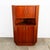 Outstanding Danish modern corner unit in teak. Comes with cabinet storage above and storage below. the center section...