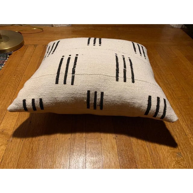 Vintage mudcloth made into a new throw pillow, backed in linen. A graphic pop for your living room or bedroom. Plays well...