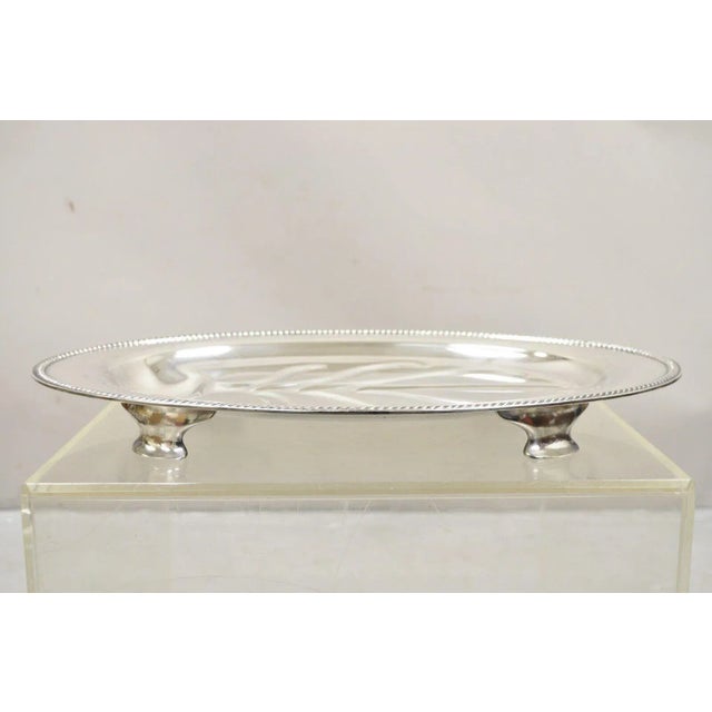 Vintage Community Plate English Regency Style Silver Plated Oval Meat Cutlery Serving Platter. Circa Mid 20th Century....