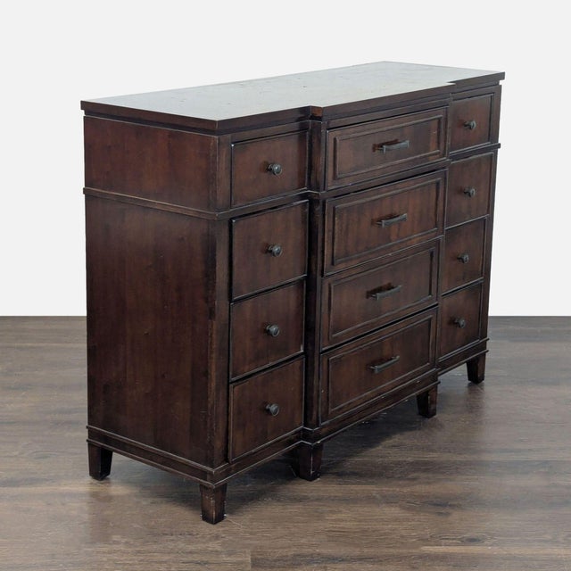 This classic dresser features a beautiful dark wood finish and offers plenty of storage with nine spacious drawers. The...