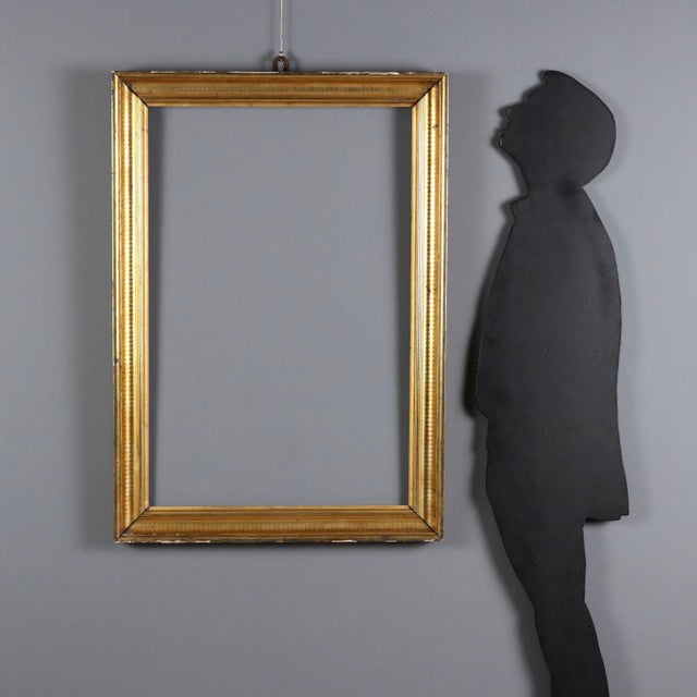 Empire style frame with gold leaf finish. Italy, early 20th century. This piece is attributed to the mentioned...