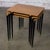Wonderful vintage MCM or Mid Century Modern stacking tables composed of walnut veneer rectangular tops, ebonized legs with...