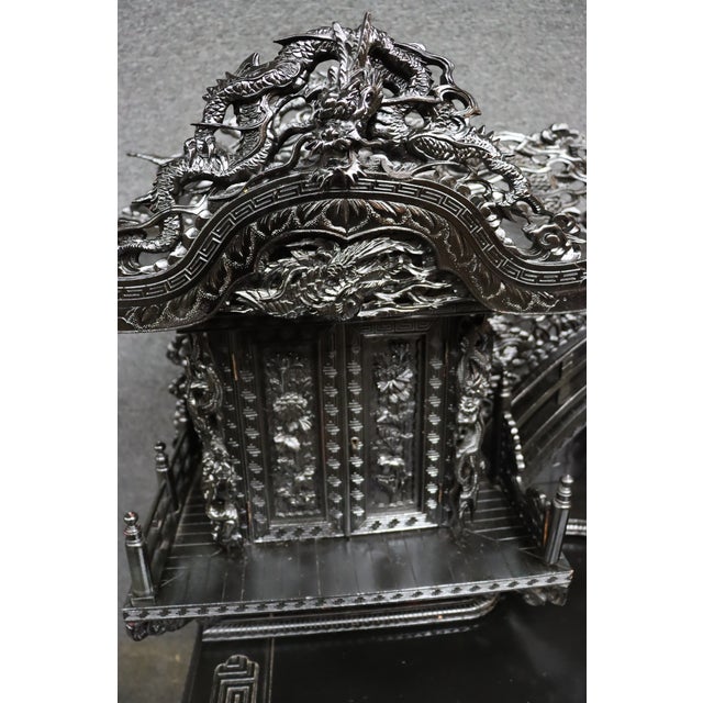 Exceptional Chinese writing desk featuring an extraordinarily elaborate carved architectural superstructure with coiling...