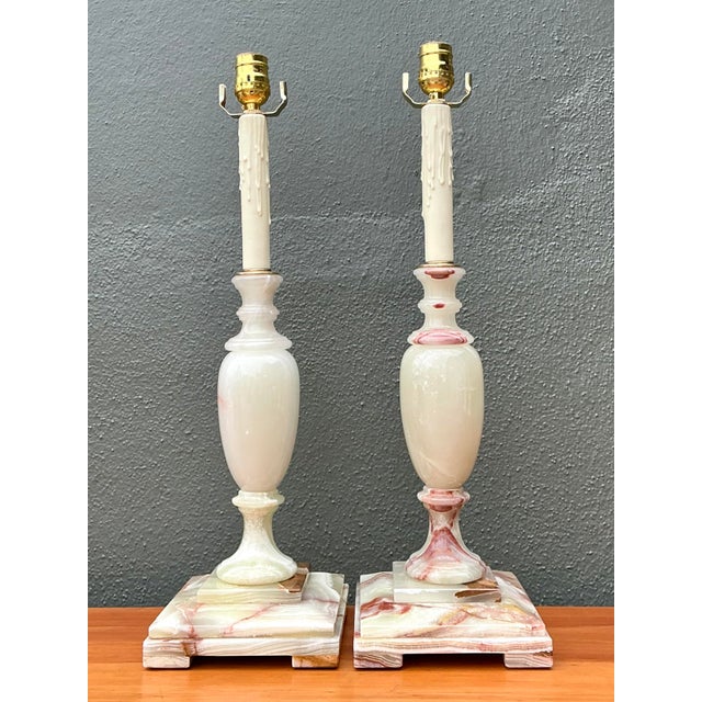 Elevate your interior with this sophisticated pair of vintage Neoclassical candlestick-style table lamps. Expertly hand-...