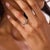This elegant contemporary fancy color diamond engagement ring is a refined design from the 2020’s, centered by a GIA-...