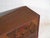 Small Japanese cabinet with decorated sliding doors crafted from paulownia wood (Paulownia spp.), originating from Japan...