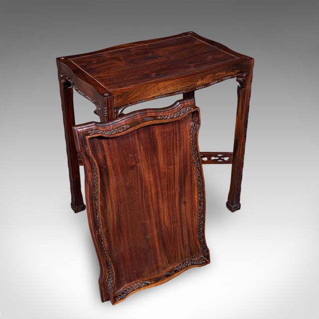 This is a vintage Chippendale revival tray table. An English, mahogany fretwork serving stand, dating to the late 20th...