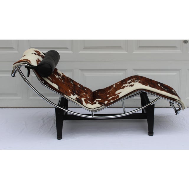 Up for sale is a Lc4 Lounge Chair by Le Corbusier for Cassina. It is done in Cowhide with black leather headrest. Overall...