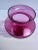 Cranberry glass Vase with lovely rim detail and traditional design of body and neck. Draping flowers in yellows, reds,...