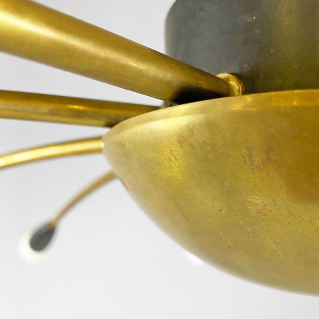 Italian mid-century modern ten lights brass Sputnik chandelier, 1950s. Sputnik style chandelier with 10 lights, with brass...