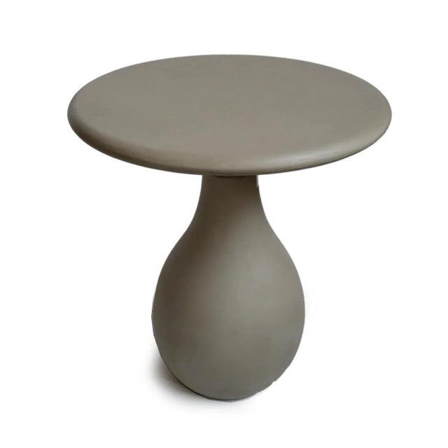 Outdoor round top lightweight cement resin mix side table with rounded base. Modern design and perfect for outdoor use....