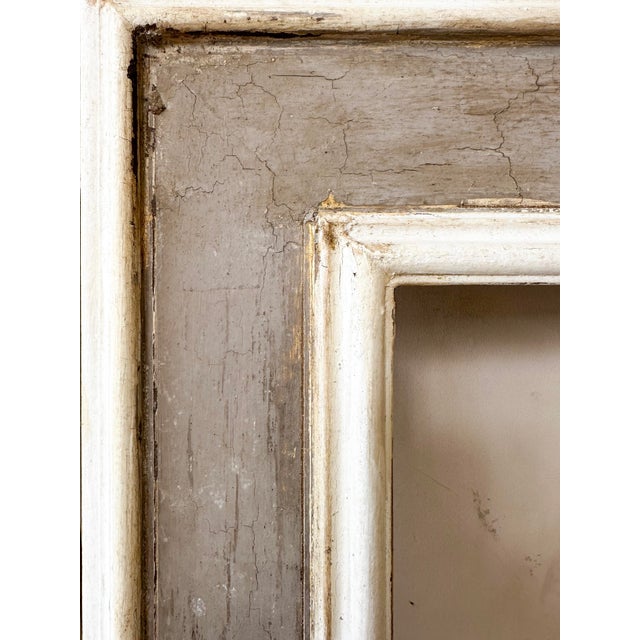 Large Italian 19th century wooden frame with a beautifully aged patinated finish. The piece stands out for its impressive...