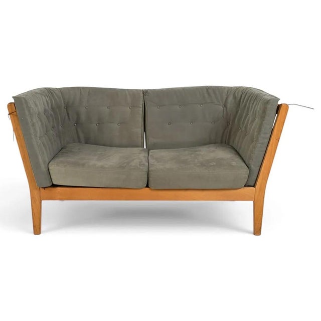 An open and airy feeling loveseat / sofa by Stouby designed by W. D. Carstens. The piece is perfect for lounging or...