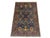This Sultani wool area rug features a deep slate-blue field filled with symmetrical floral vines and blossoms. Burgundy,...