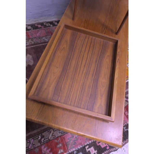 Unusual set of coffee tables and a tray in teak by Johannes Andersen for Trioh, Denmark 1960s. The smaller coffee table...