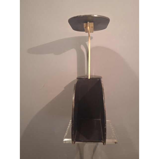 Rare Art Deco side table with magazine rack. Wood painted black and cream white. This piece has an attribution mark, I am...