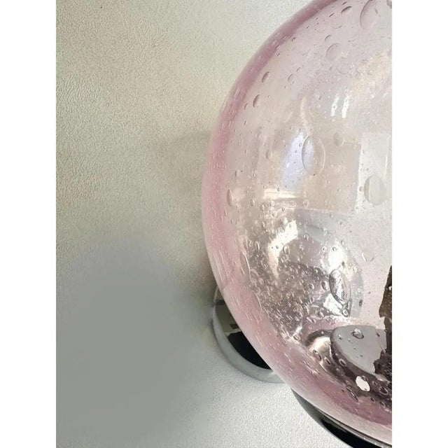 Luxury modern pink sphere in murano glass working with “pulegoso” a traditional tecnique of murano that give bubbles...