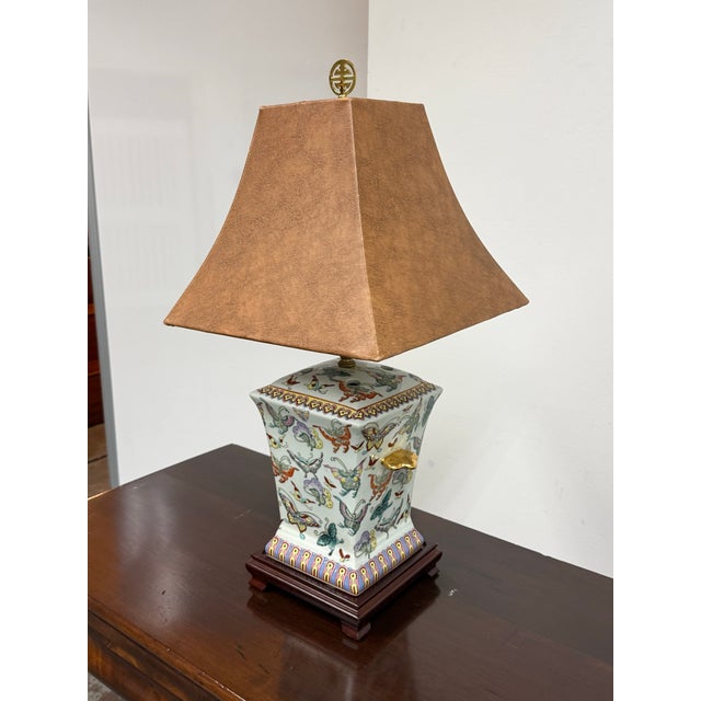 Design Plus Gallery presents a Chinoiserie Porcelain Butterfly Motif Table Lamp. The porcelain base has a shaped urn form...