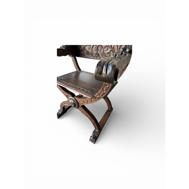 These chairs feature a signature curule X-frame construction with intersecting S-shaped legs. The backs are intricately...