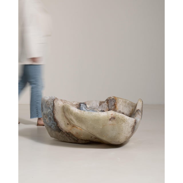 This mid 20th century decorative bowl from Brazil is finished in light gray, worked in agate. Its form follows honest,...